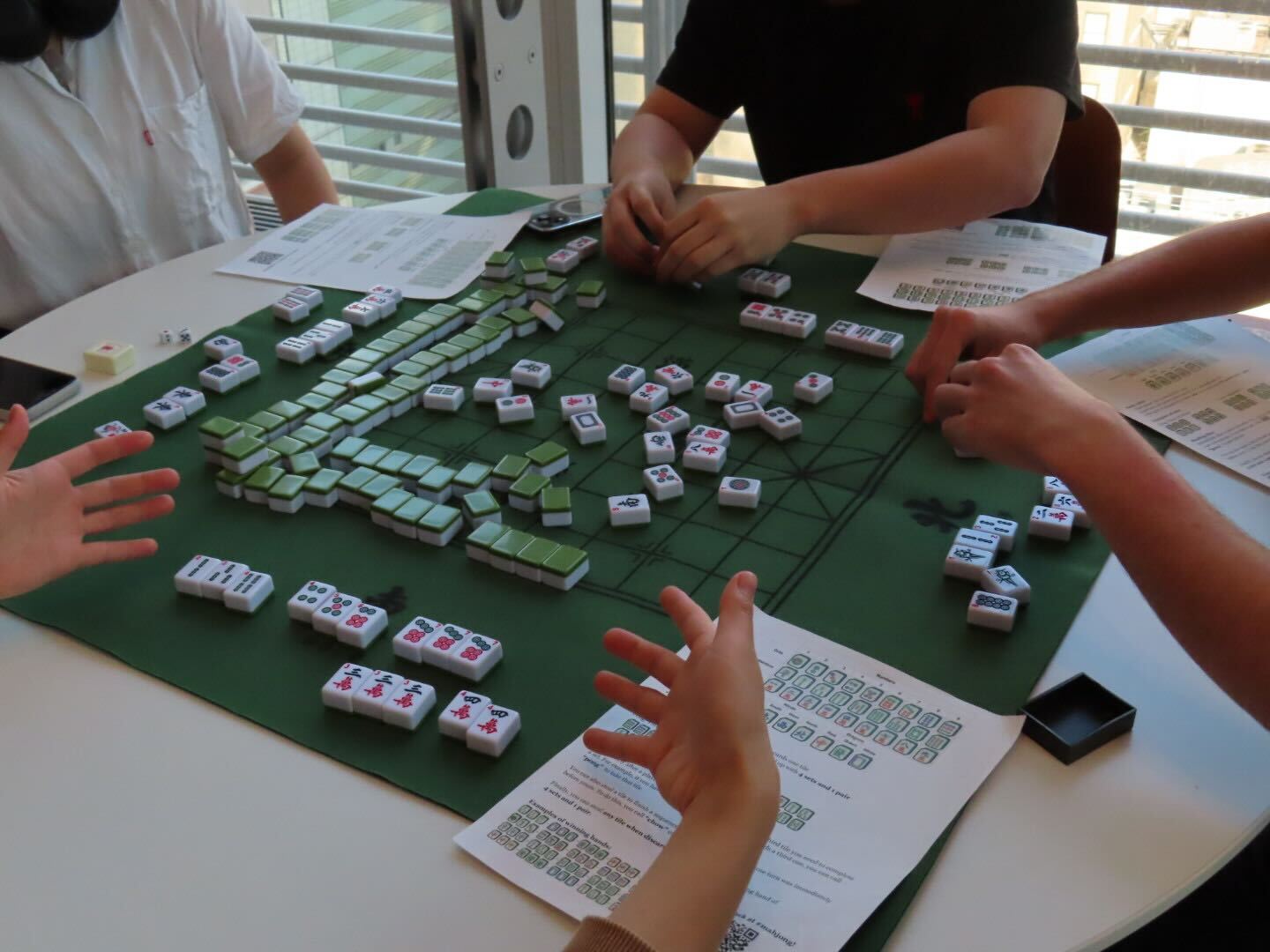 Students learning mahjong